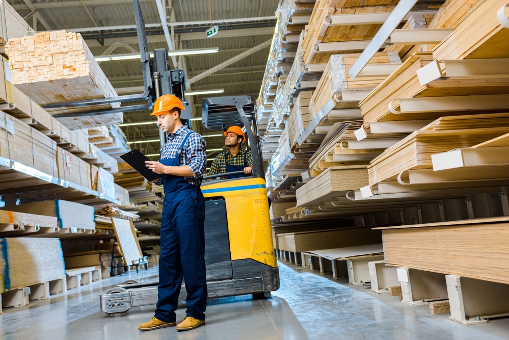 Warehouse Employee Taking Inventory and Cleaning