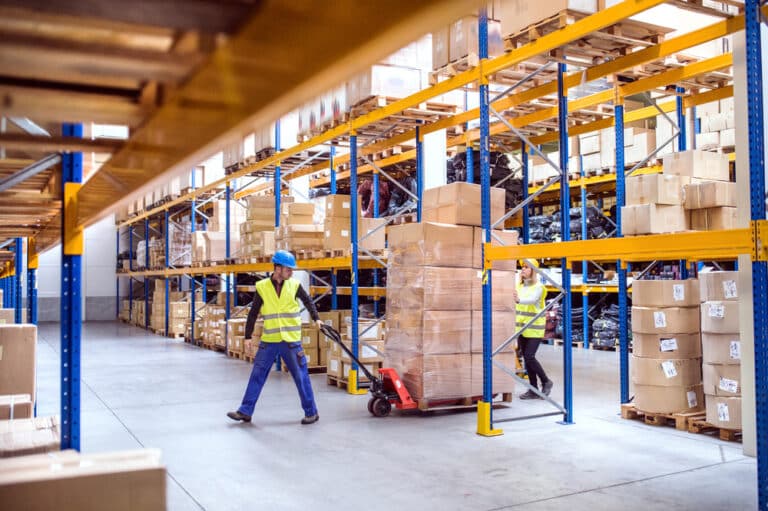 Warehouse Worker With An Electric Pallet Jack