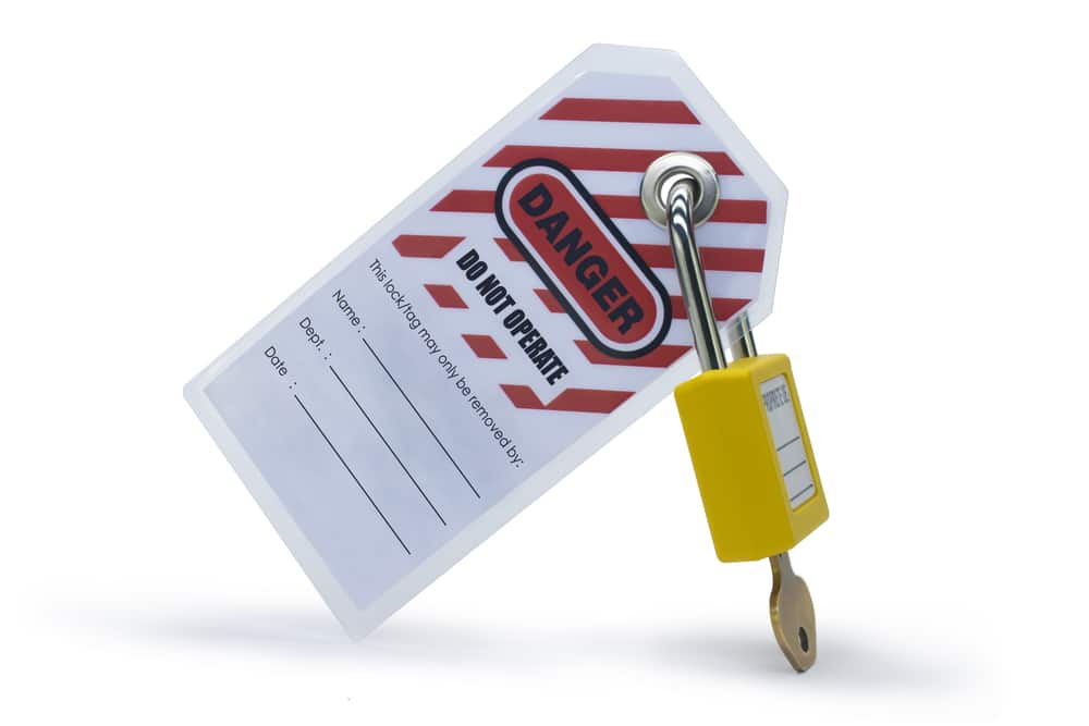 A yellow tag with a lock attached to it.