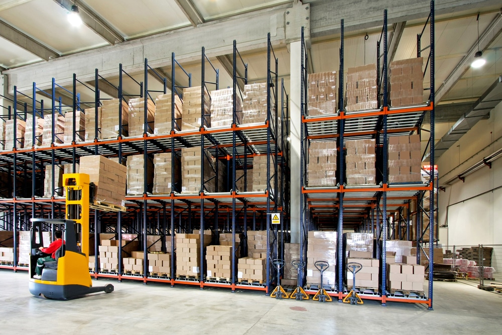 A forklift in a warehouse moving materials