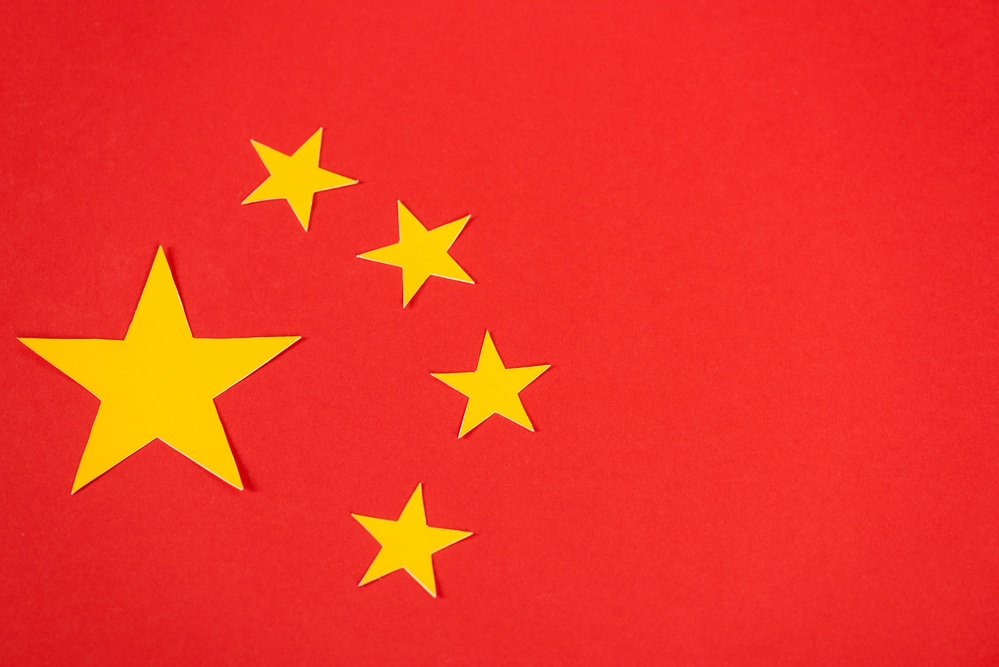 Chinese flag with stars on a red background.