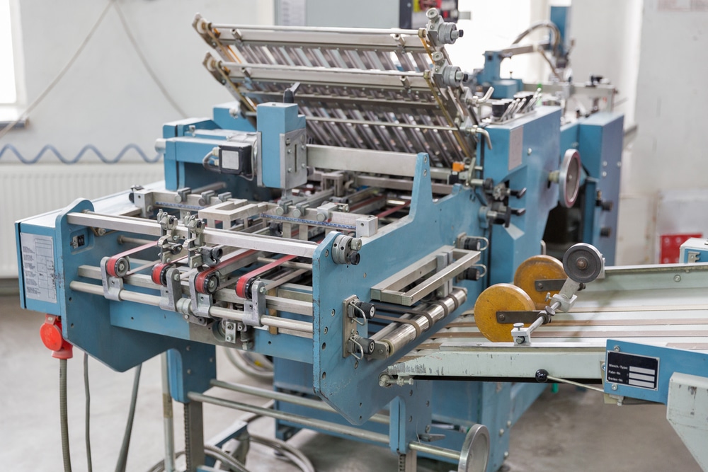 A machine is making paper in a factory.