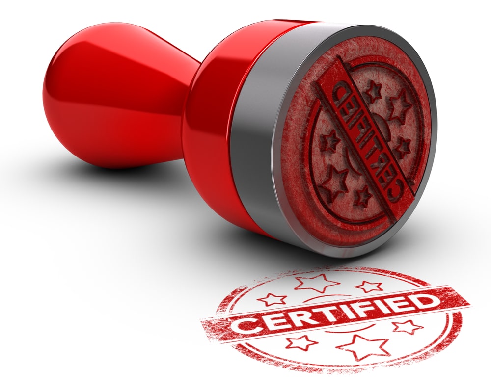 A red rubber stamp with the word certified on it.